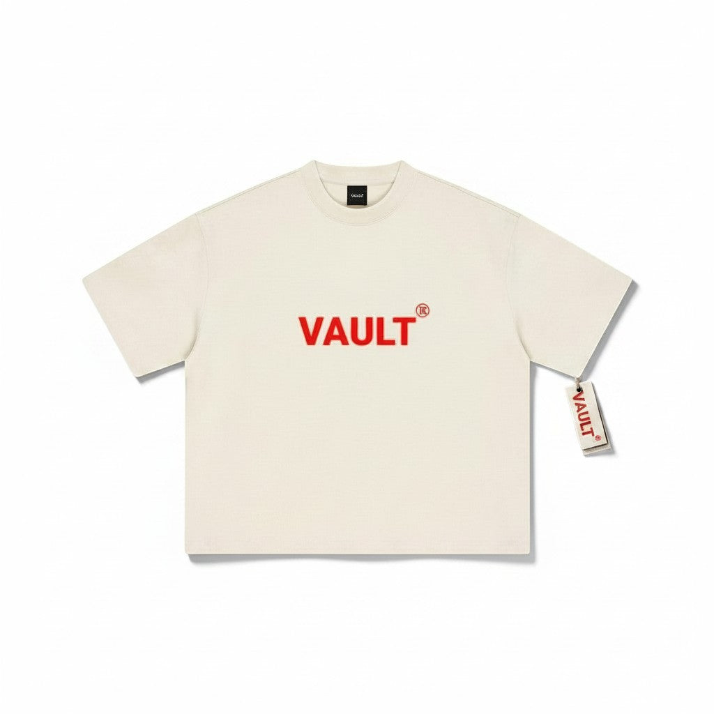 VaultWear cream heavyweight cotton t-shirt with a bold red logo graphic on the chest and a relaxed boxy fit.