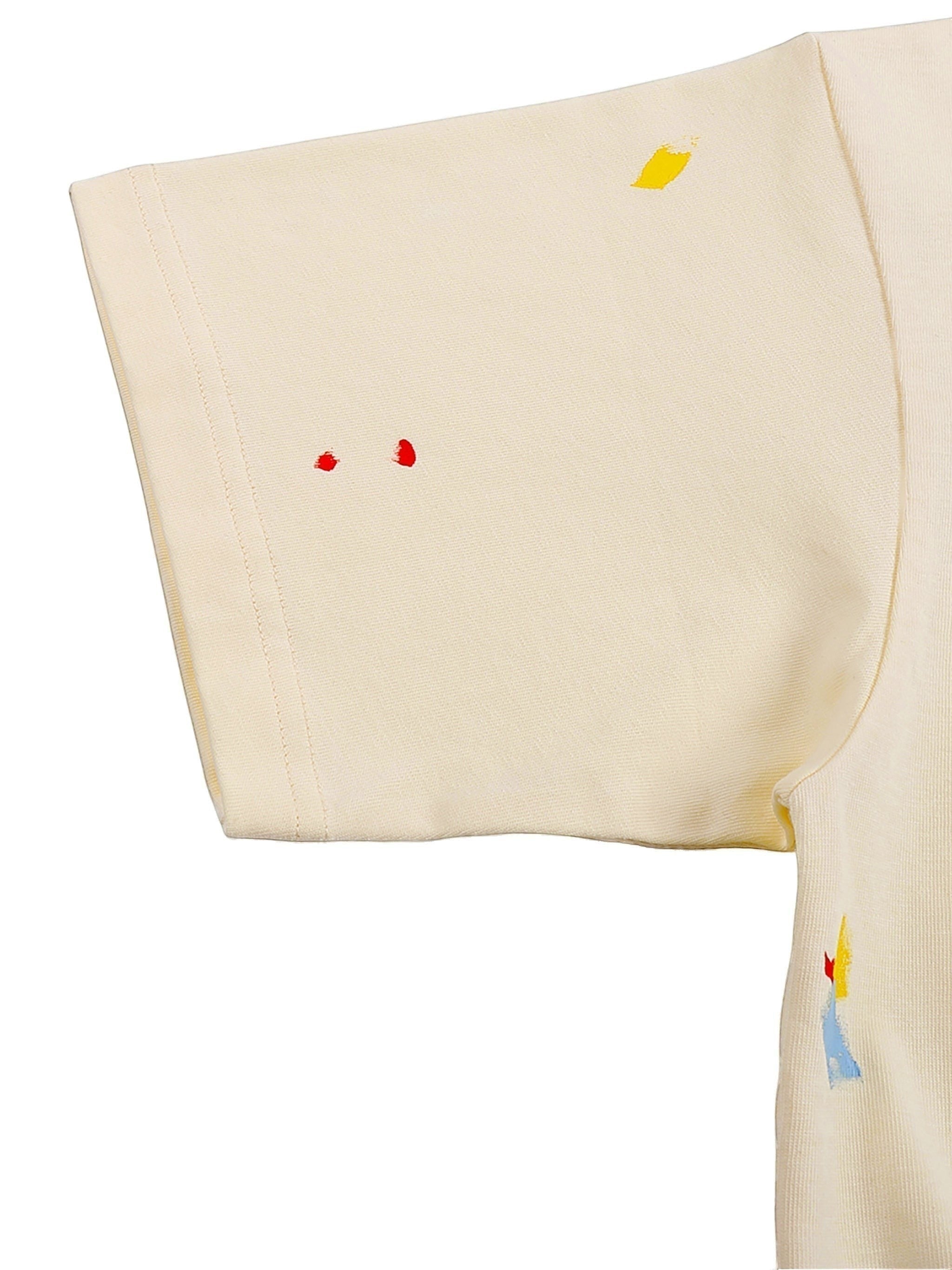 VaultWear cream cotton t-shirt sleeve with artistic multi-colored paint splatter details