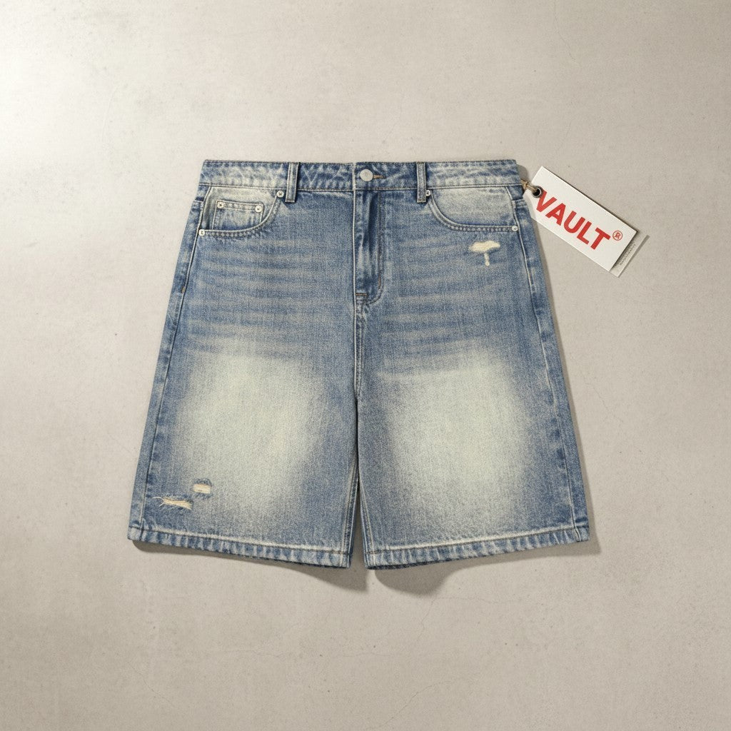 VaultWear faded blue denim shorts with a baggy fit, distressed details, and a branded tag on a neutral background.